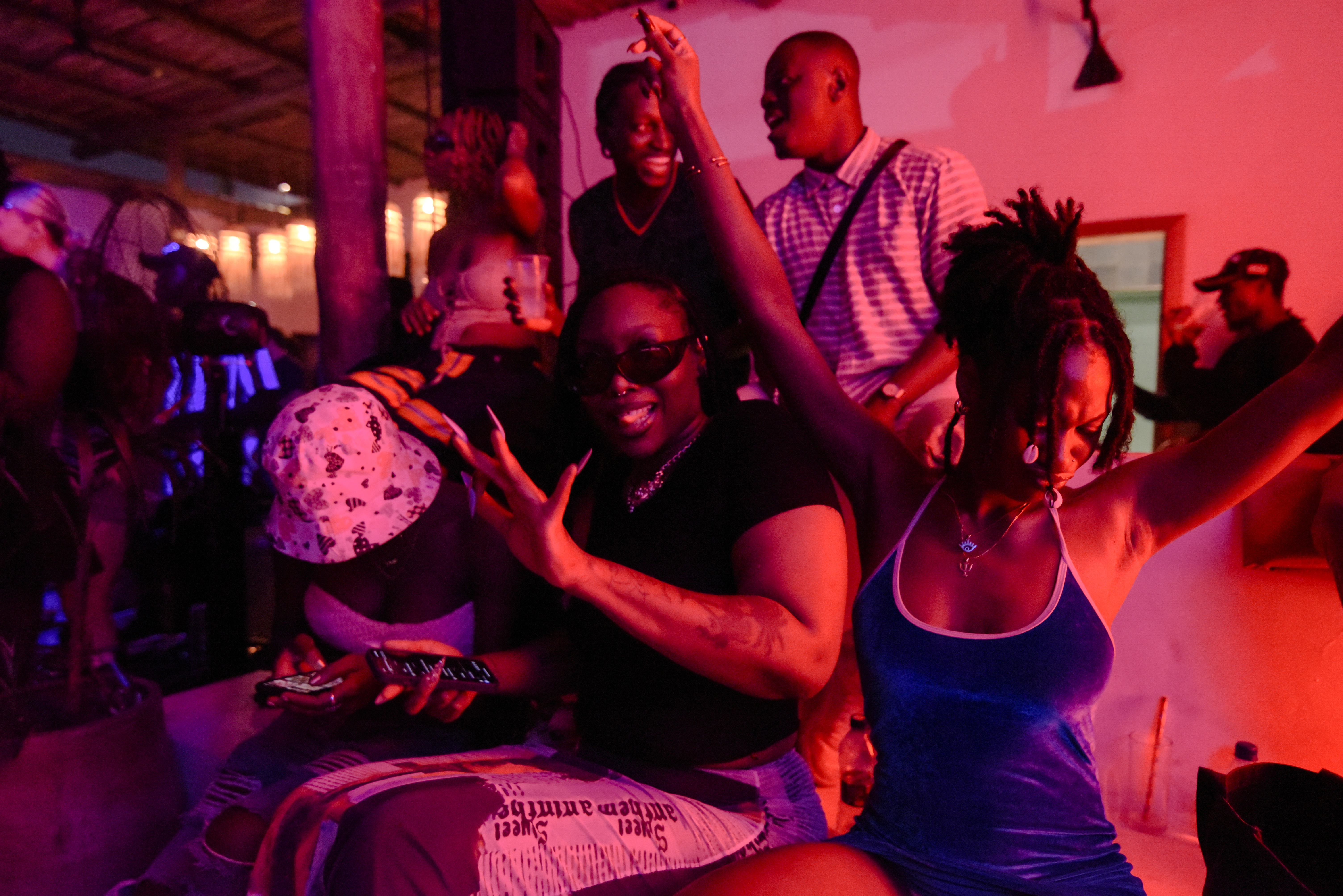 cheerful young people photographed during a nightlife event hosted by Oroko Radio in Accra